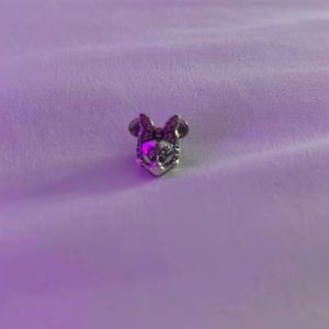 Minnie Mouse makes her mark on this glittering sterling silver charm.